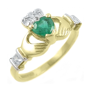 ladies yellow gold claddagh ring set with emerald and diamond